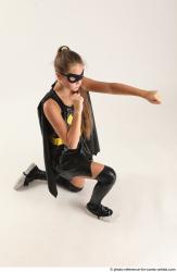 Naty BATGIRL KNEELING POSE 2